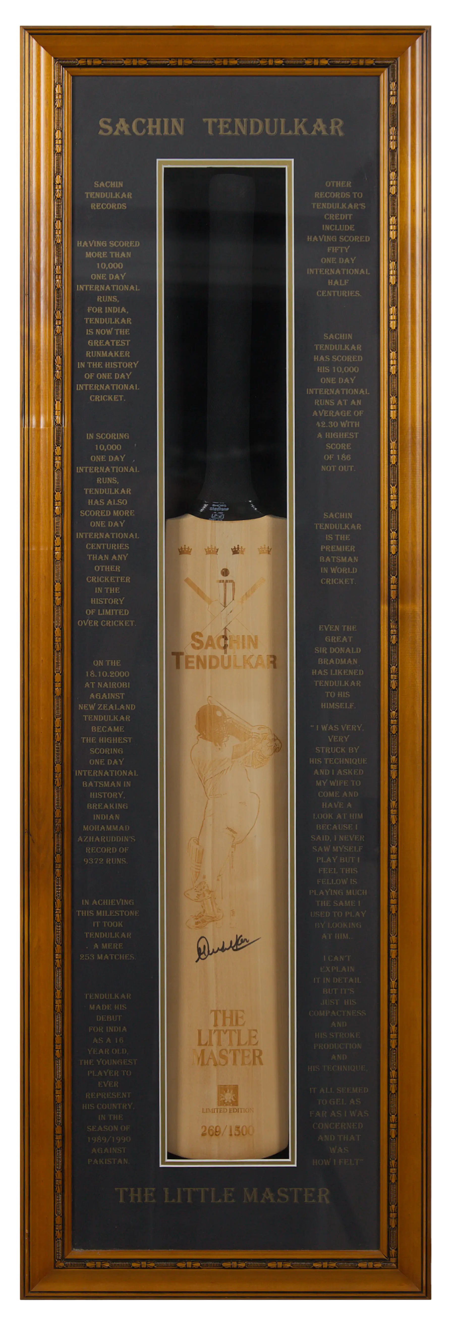 Signed cricket bat framed in a display case
